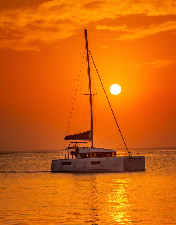 Boat sailing in sunset